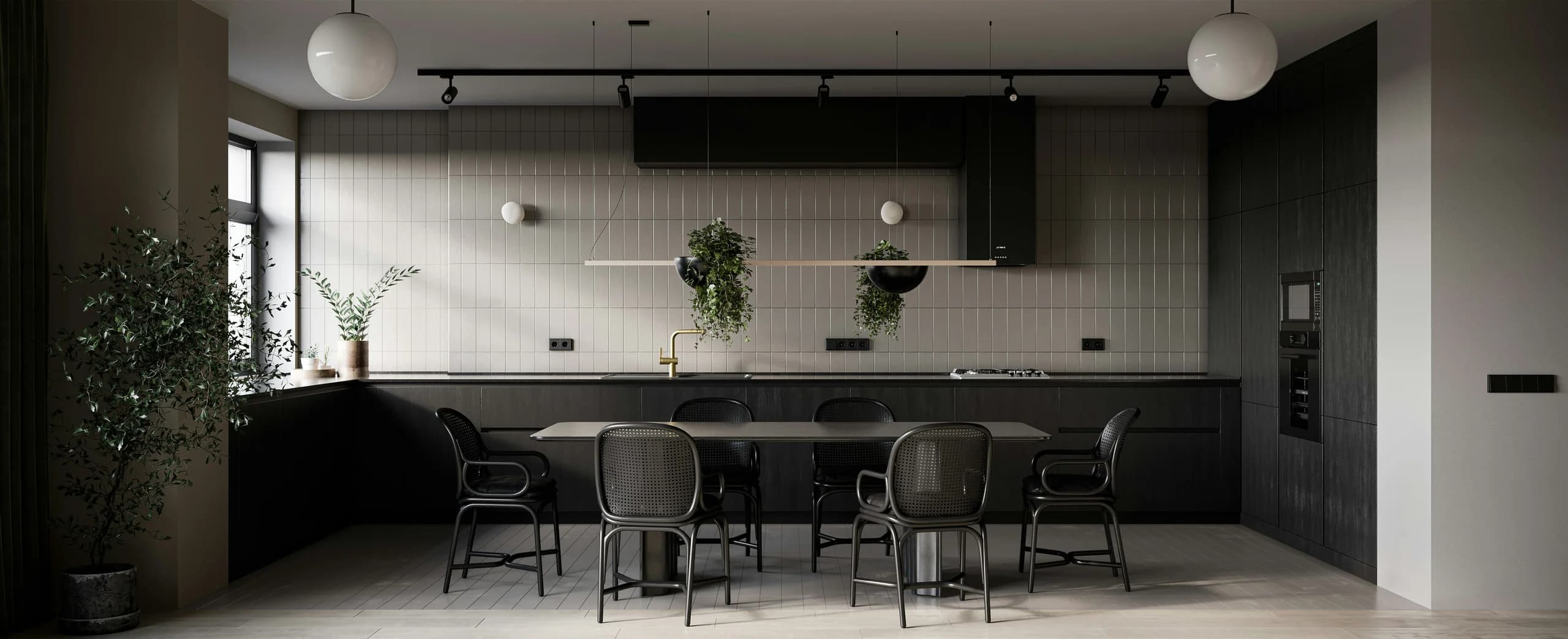 Dark kitchen with a pale tiled splashback, tall cabinetry, a central dining table, black chairs and suspended planting